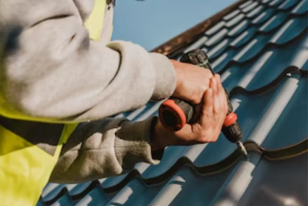 image of a professional repairing a shingle roof leak